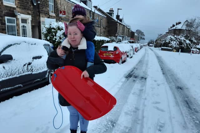 Here are the odds of a white Christmas this year. Pictured is a mum and her child spotted on School Road, Crookes, November 27, 2021.