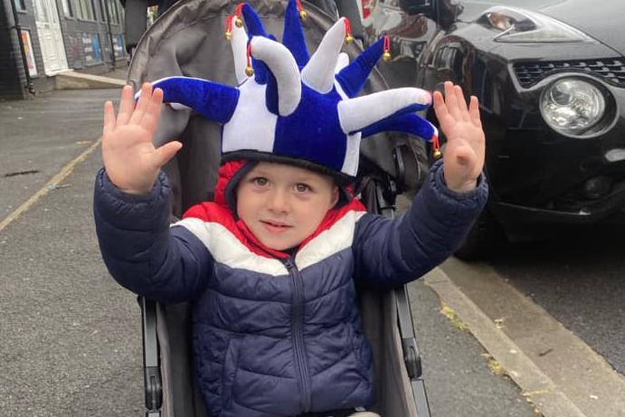 Harry, age 2, gets his hands up for the lads!