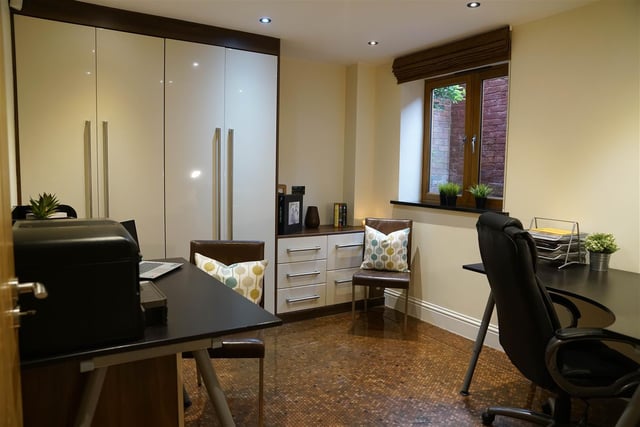 The spacious office is in the basement level and can also be used as another bedroom.
