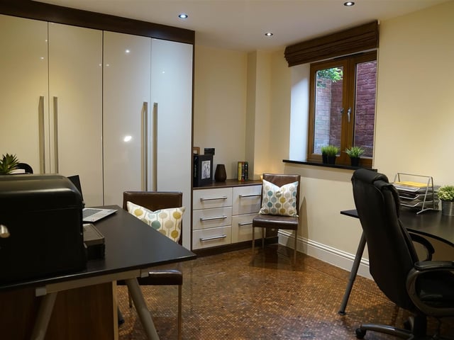 The spacious office is in the basement level and can also be used as another bedroom.
