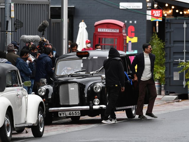Leaving a taxi.