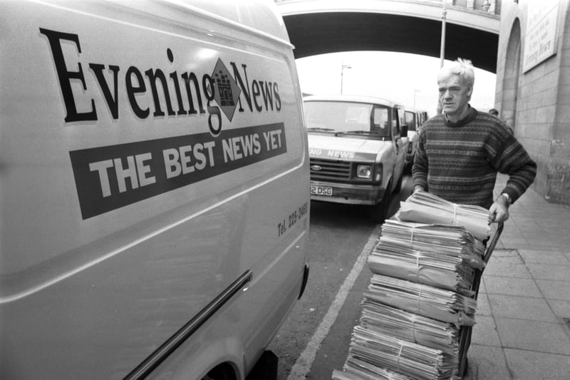 A TSPL delivery driver loads the new look Evening News newspaper onto his new look van in Market Street, outside Scotsman Publications headquarters at North Bridge Edinburgh, September 1989.