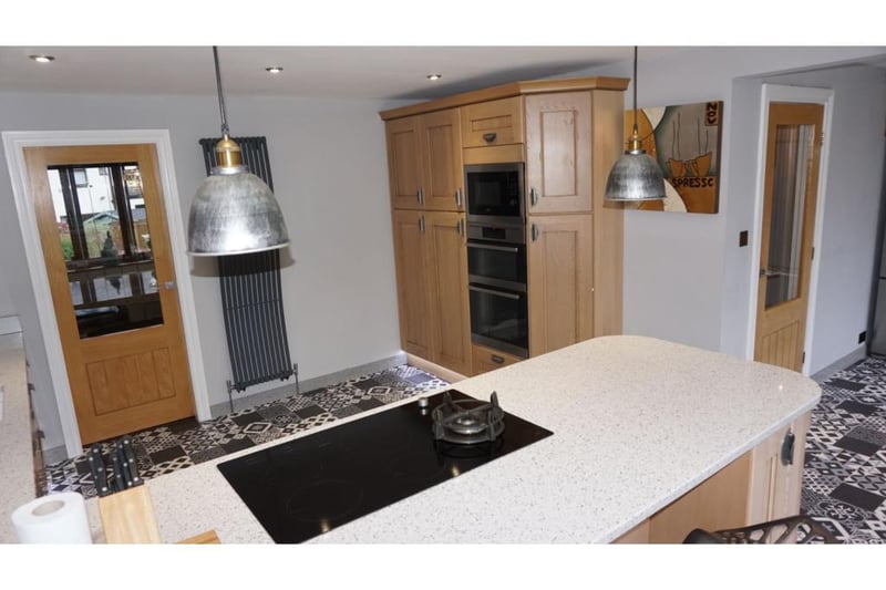 Comprehensively fitted and equipped with a range of cooking appliances, including halogen hob, and granite worktops.