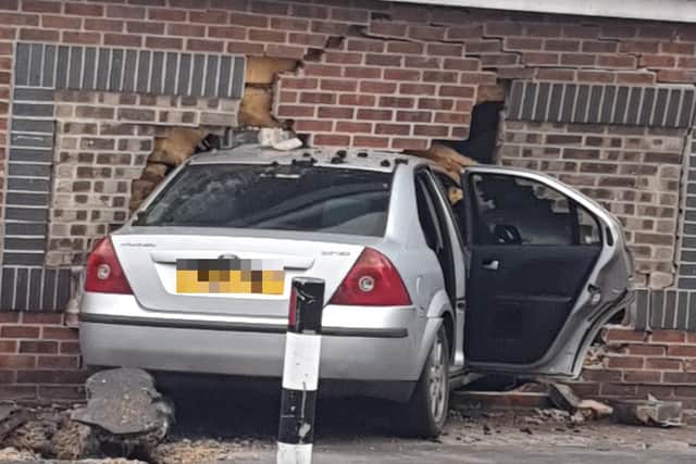 This silver Ford Mondeo was left embedded in the wall of the Ladysave cosmetics shop at the corner of Bellhouse Road and North Quadrant in Firth Park, Sheffield, following a dramatic crash (pic: Heidi Oliver)