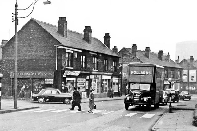 Penistone Road, Sheffield, near the junction with Upper Slack, in March 1963. Pictured are the newsagents Achibald McGibbon and other businesses