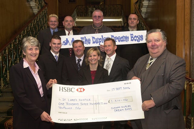 Sheffield Master Cutler Neil Turner presents a cheque for £1,310 to Margaret Carradice matron at St Luke's Hospice. The money was raised from a Full Monty show by the Duplex Dream Boys. From left are, back row: Dave Addis, Clive Wren, Dave Marriott, Charlie Briggs. Centre row: Chris Lawton, Gary Darwent, choreographer Helen Elian-Lycett and Shaun Doncaster