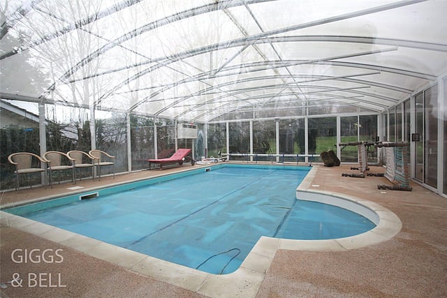 The large exterior swimming pool is covered by a glass roof for residents to enjoy both in the winter and summer months, regardless of the weather.