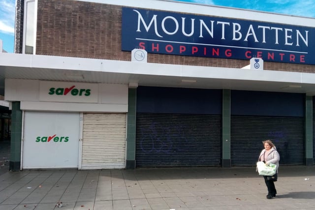 A lonely shopper passes the closed Mountbatten Centre