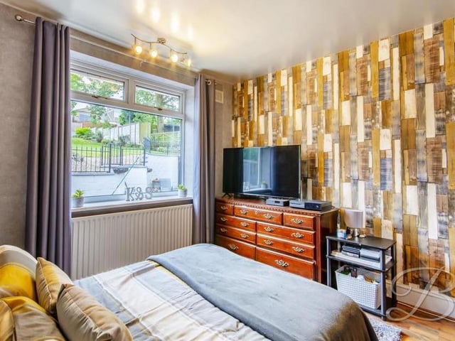 The third bedroom is bright and cheerful. It also houses a cupboard for the gas central-heating boiler.