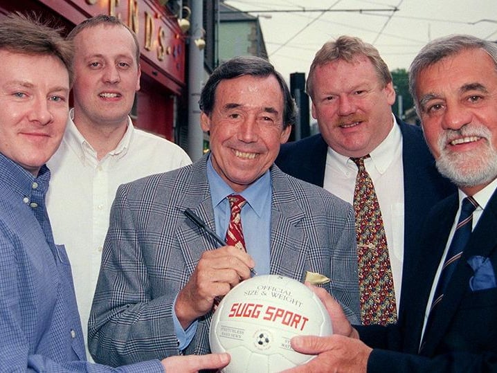 Gordon Banks signs a football at Legends, Hillsborough, with John Lee, Darren Foden (manager), David Mann and Trelford Mills looking on, July 1, 1998