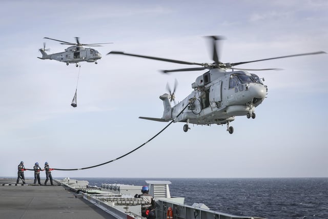 Merlin Mk2 helicopters of 820 Naval Air Squadron conduct Helicopter In Flight Fuelling (HIFR) and Vertical Replenishment (Vertrep) onboard HMS Queen Elizabeth.

HMS Queen Elizabeth has embarked two squadrons of F-35B stealth jets: the UKs 617 Sqn and US Marine Corps fighter attack squadron 211. Alongside eight Merlin helicopters of 820 and 846 Naval Air Squadrons it is the largest air group to operate from a Royal Navy carrier in more than thirty years, and the largest air group of fifth generation fighters at sea anywhere in the world. This months Group Exercise (GROUPEX) will see HMS Queen Elizabeth joined by warships from the UK, US and the Netherlands, which will accompany the carrier on her first global deployment in 2021. However, before then, the newly-formed Carrier Strike Group will be put through its paces off the north east coast of Scotland as part of Joint Warrior, NATOs largest annual exercise.