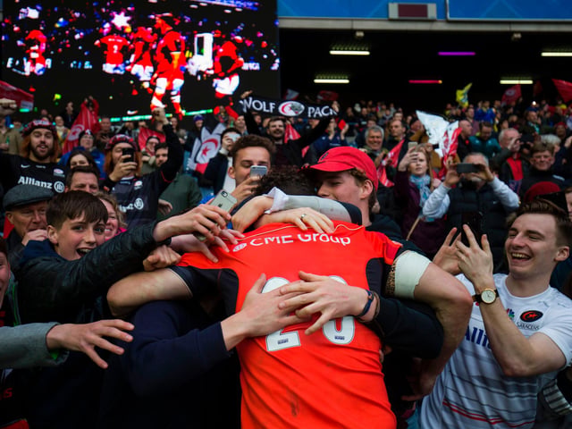 Saracens' Scottish centre Duncan Taylor celebrates with supporters at Murrayfield after the 28-17 win over French side Clermont Auvergne in the 2017 European Champions Cup final. In securing victory, Saracens set a new record of 18 consecutive unbeaten European games.