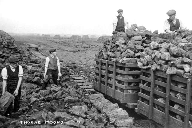 Workers removing peat from Thorne Moors near Doncaster