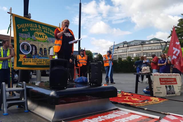Scores of protesters gathered at Sheffield Station today in support of striking rail workers and to protest over the cost of living crisis. Maxine Bowler of Sheffield Trade Union Council is pictured speaking