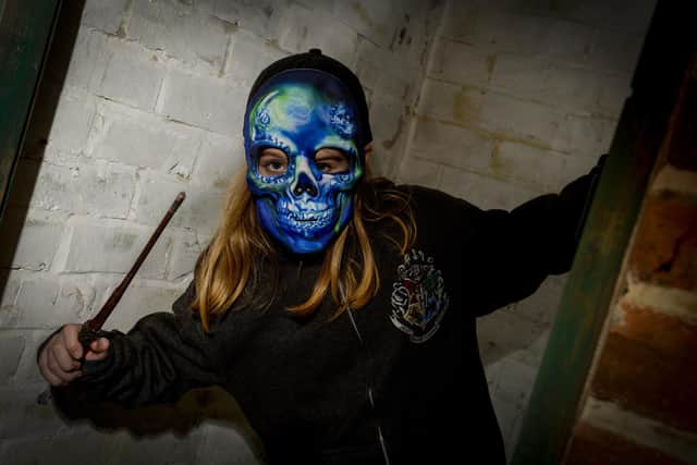 Daisy Holden hides out waiting to scare one of the visitors at Kelham Island Museum - other venues encouraging children to showcase their best fancy costumes this year include Gulliver's Valley Resort. Photo by: Dean Atkins.