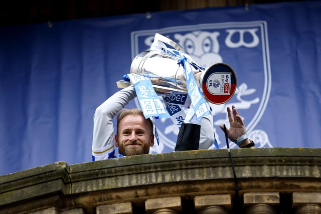 Barry Bannan lifts the trophy on the balcony of Sheffield Town Hall. Picture Richard Sellers/PA Wire.