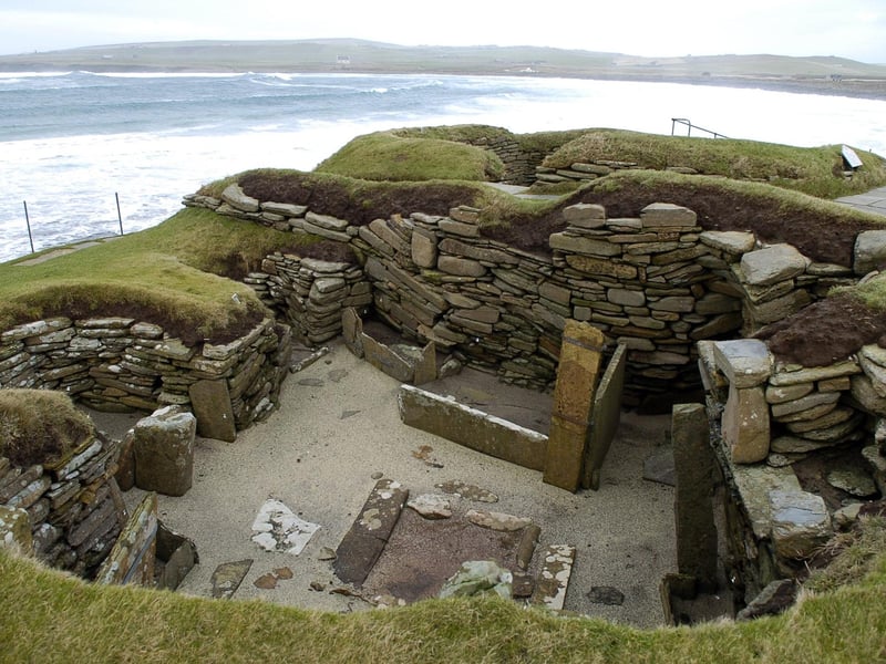 Excellent visitor and orientation centre. Can be a windy (500m) walk to this remarkable shoreline site, the subterranean remains of a compact village 5,000 years old.
It was engulfed by a sandstorm 600 years later and lay perfectly preserved until uncovered by the laird’s dog after another storm in 1850.