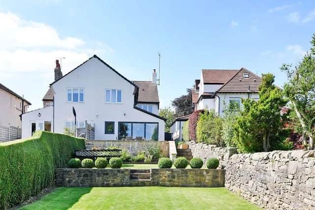 The beautifully landscaped gardens are one of the many features of this attractive and extended four bedroom house situated in the heart of Dore village.