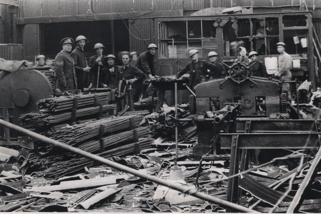 Blitz damage at W T Flather Ltd and soldiers helped with the clear up.