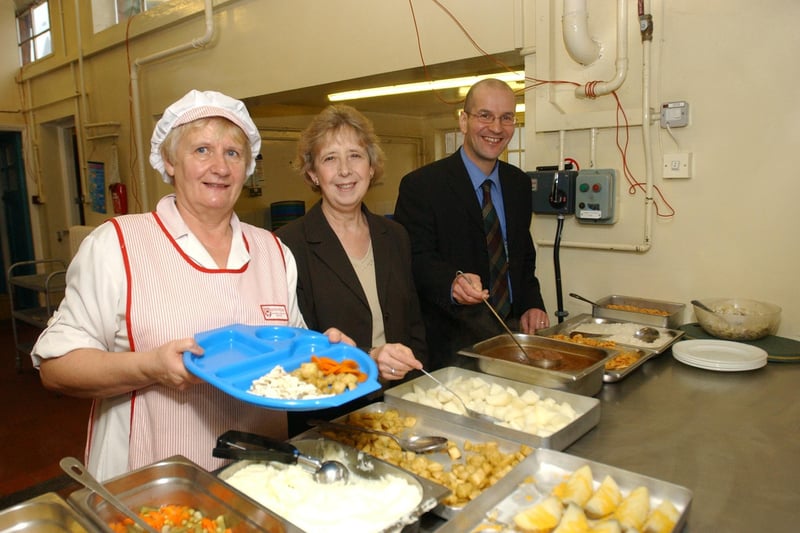 Ann Gibson got a helping hand with serving in 2004 as she served up food with Paul Baldaera and Coun Moira Smith helping out.