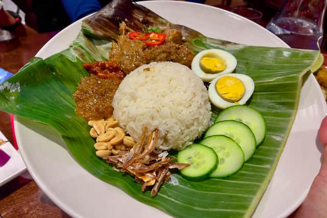 Nasi Lemak - fragrant coconut rice served with assorted condiments and traditionally spiced beef rendang.
