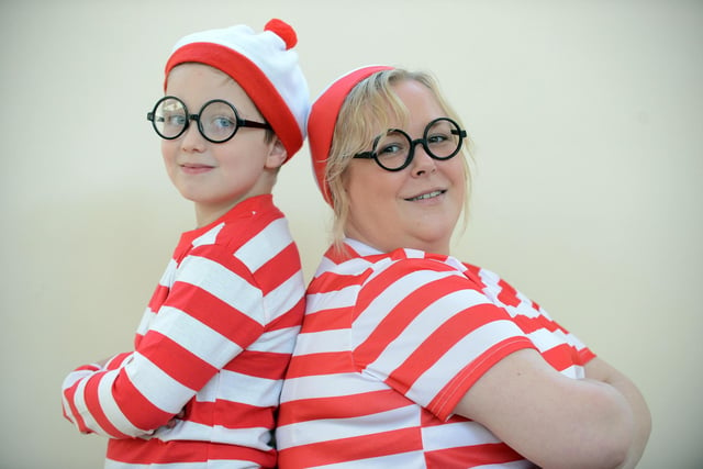 Thornhill Park School pupil Issac Wilson, 9, and teacher assistant Kathryn Myers dress as Where's Wally for World Book Day