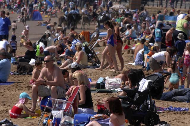 These cheap UK holidays all cost less than £300 – and are under 200 miles from Sheffield. Pictured is a packed South Bay Scarborough Beach
PICTURE GERARD BINKS