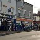 Pictured is the growing, long queue at Mother Hubbard's fish and chip shop, on London Road, Sheffield, during its opening day launch when generous staff served up fish and chips for 45p for each customer.