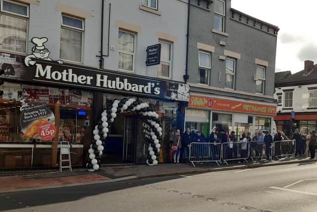 Pictured is the growing, long queue at Mother Hubbard's fish and chip shop, on London Road, Sheffield, during its opening day launch when generous staff served up fish and chips for 45p for each customer.