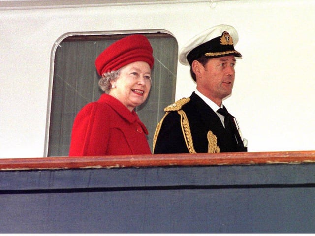 The Queen and Commodore Anthony Morrow,  Britannia's commanding officer, aboard The Royal Yacht Britannia in Portsmouth before the vessel was paid off after 44 years of service .