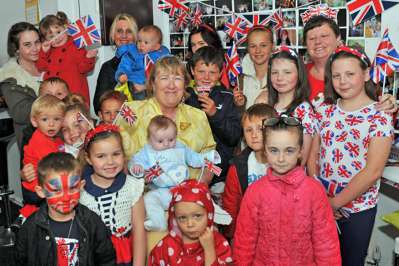 Children and parents shelter from the rain during the Greenock Road Jubilee street party 9 years ago. Were you pictured?