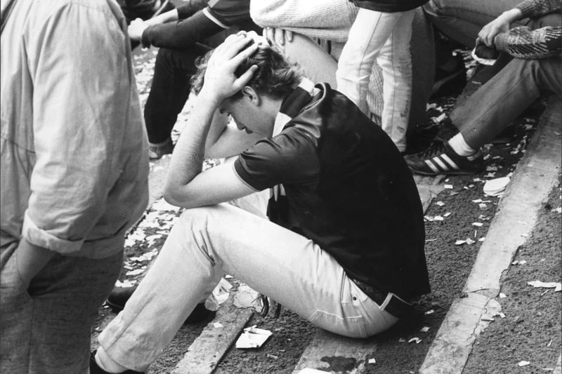 Dundee v Hearts. A Hearts fan holds his head in his hands as the league title slips away in 1986.