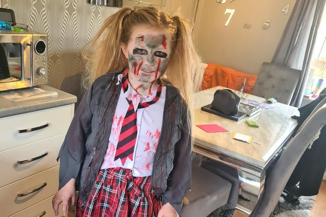 Hunni-Rae Reeves shows off her Halloween outfit and make-up.