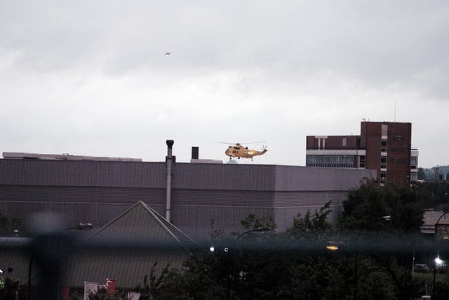 Helicopters plucked people from rooftops in Brightside due to the floods