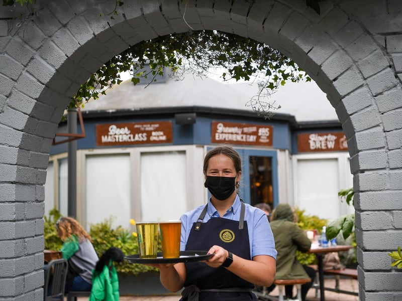 Staff serve drinks at Brewhouse & Kitchen pub in Southsea.