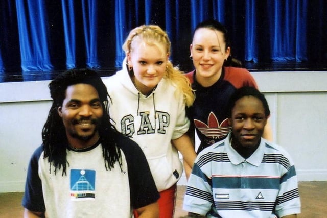 Dance group Siyaya took Black History Month celebrations into Firth Park Community College in 2002. Deana Kemp and Roxanne Talbot are pictured back row (left to right) getting some tips on how to play the drums from Tawanda Moyo of Siyaya  and Jerome Whyte (both front row)