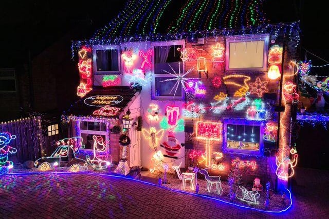 Nicknamed the ‘Christmas House’, this festive display by resident Phillip Gratton includes a includes a snow machine, a 12ft Christmas tree and a wishing well where admirers can put a donation for St Luke' Hospice.
