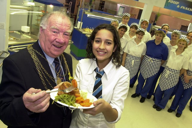 The Civic Mayor of Doncaster, Councillor John Quinn, tucked into a meal at Ridgewood School's new Dimensions food court back in 2002. Looking on is pupil Hanna Flint, aged 14, and food court staff.