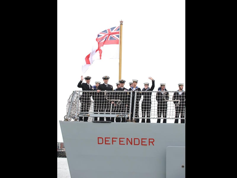 HMS Defender returned home into Portsmouth on 12th December 2014 after more than six months away deployed on high intensity operations in the Northern Gulf. 
Pictured is: HMS Defender arriving into Portsmouth.
Picture: Sarah Standing (143541-8710)