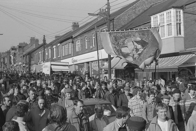Scores of miners carrying banners demonstrate in Easington back in October 1984.