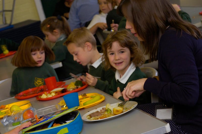 Totley All Saints Primary School tuck into their food as part of a Roast Dinner Day in 2010