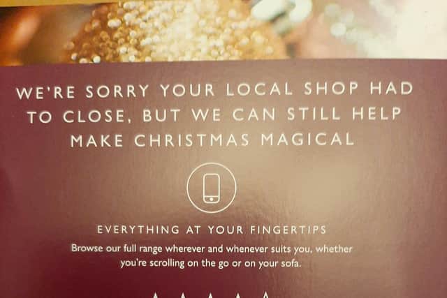 Inside the John Lewis Christmas catalogue is an apology and directions of how to shop online