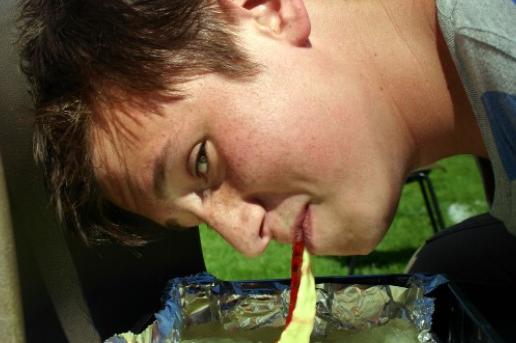 A competitor taking part in the jelly relay race during an It's A Knockout event at the Horse & Groom pub in Linby