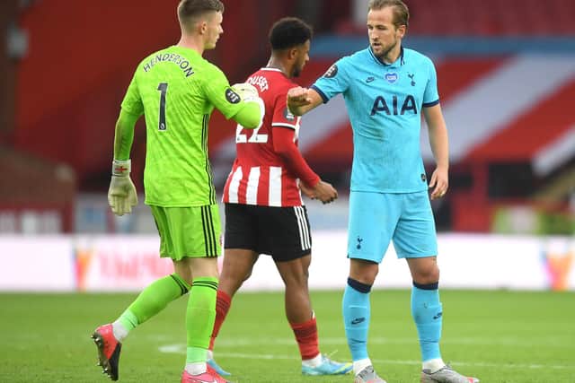 Dean Henderson of Sheffield United speaks to Harry Kane of Tottenham Hotspur after the Premier League match between Sheffield United and Tottenham Hotspur at Bramall Lane (Photo by Michael Regan/Getty Images)