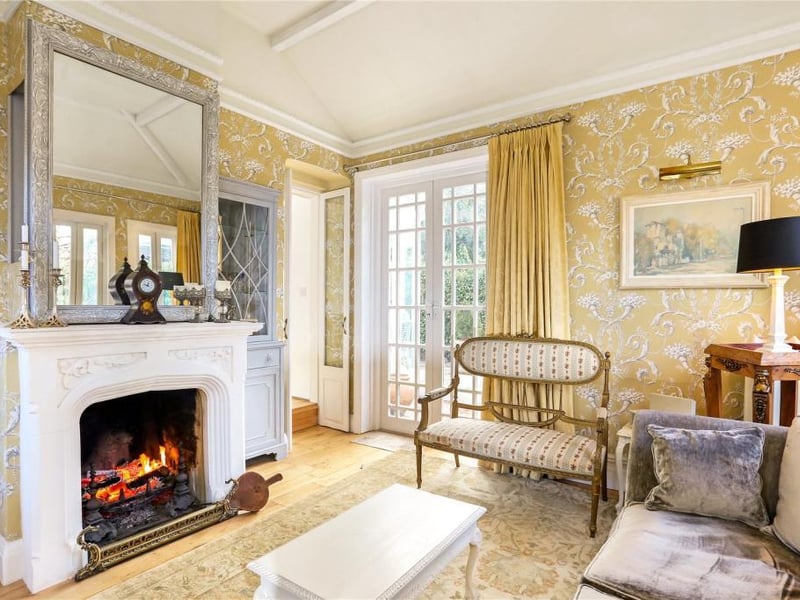 With French doors, open fireplace and Juliet balcony.