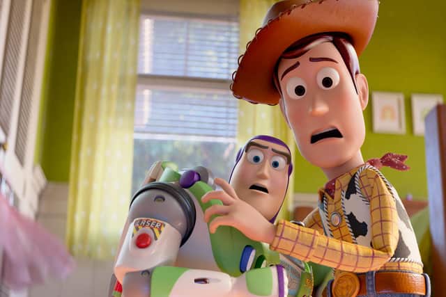(L-R): Buzz Lightyear (voiced by Tim Allen) and Woody (voiced by Tom Hanks) in Disney and Pixar's TOY STORY 5. Photo courtesy of Disney/Pixar.