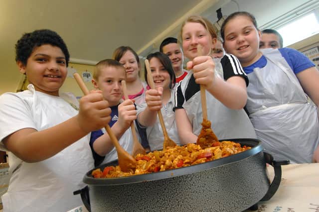 These pupils were learning the art of cooking in this 2010 scene. Take a look and see if you can spot someone you know.