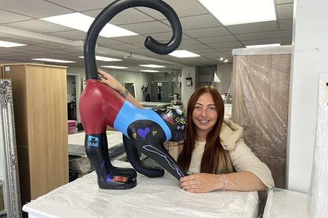 Nikki Clark from Sanderson's Furniture and Auction in Andrew Street with their monkey. Picture by FRANK REID