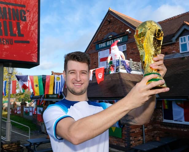 James Dobson at The Belfry in Beighton, Sheffield outside the pub decorated for the Qatar World Cup