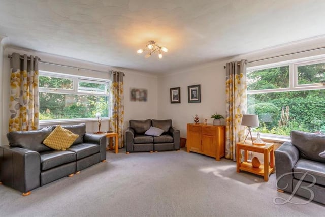 If there's one room in the property that has the wow factor, it's this living room. It is beautifully decorated and boasts triple-aspect windows.
